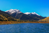 Snowcapped Red Mountain over Crystal Lake
