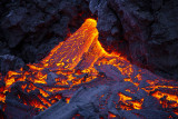 the Door to Hell ,molten rock, emerging as a liquid onto Earth's surface.
