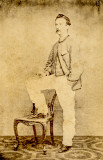 Hand in Pocket, Foot on Chair 