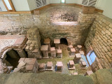 The Hot Tub (Calidarium) the top of the photo with the hypercaust opoen to view in the fore ground - Chedworth Roam Villa