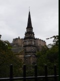 The Parish Church of St Cuthberts spire with Edinburgh Castle in the back ground