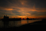 Ships on the Mississippi River at Sunset