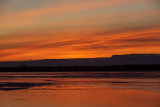 Orange and yellow skies reflected in the Bay of Quinte