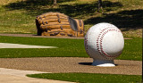 A giant baseball and glove.