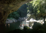 Swimmers in the pool below Natural Arch