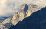 Half Dome crowned by clouds as seen from the Tunnel View in Yosemite National Park