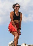 Yosemite fan poses on top of a windy Sentinel Dome in Yosemite National Park