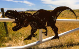 Dinosaur mounted on the gate to Jurassic National Monument