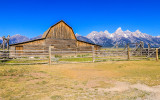 The Tetons frame the John Moulton Homestead Barn in Grand Teton National Park