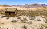 Line shack with the mine in the distance in the Rhyolite Historic Townsite