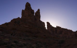 The sun sets behind the Rudolph and Santa Claus formation in Valley of the Gods