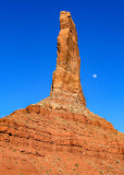The moon behind Castle Butte in Valley of the Gods