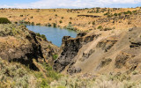 The Snake River winds through volcanic formations in Massacre Rocks State Park
