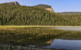 The surrounding landscape reflected in Crystal Lake in Lewis and Clark National Forest