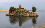 The lake island reflected in the waters of Ennis Lake