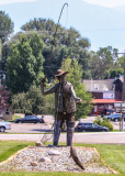 City of Ennis Montana fisherman sculpture in the center of town