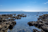 looking over the rocky shoreline to Kapiti Island