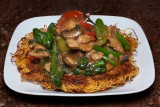 Chicken with Chinese broccoli on pan fried noodles
