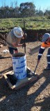 Filling the column footing and agitating the concrete 