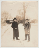 Two unknown men outside