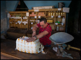 Cutting a fresh delivery of cheese - Camagüey