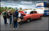 Taxi leaving tourists at the airport