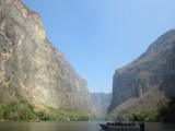 Boats give some perspective to the height of the cliffs