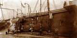 HMS GANGES WITH SUBS ALONGSIDE - UNDATED BUT C5 WAS COMMISSIONED IN 1906 AND SOLD FOR SCRAP IN 1919.jpg