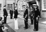 1956 - DICKIE DOYLE, BUTTON BOY PADDY DEARNS RECEIVING HIS COIN FROM THE DUKE OF EDINBURGH WITH CAPTAIN LE FANU LOOKING ON
