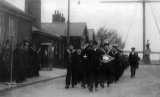 UNDATED - MARCH PAST WITH TROPHIES, THE DIAMOND SHAPE IS BEST OVERALL GYM TROPHY, DONATED BY JIM WORLDING.jpg