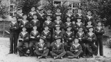UNDATED - CLASS OR CLASSES OF NEWLY QUALIFIED BOY TELEGRAPHISTS WITH INSTRUCTOR IN CENTRE WITH A WHITE CAP.jpg
