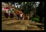 The offerings consist of fruits, rice cakes and flowers and are carried on womens heads to the temple