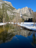 Yosemite Falls reflected in the Merced River.