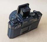The original Canon F1 (1971); with the waist level view accessory. 