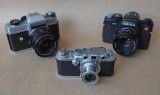 The Leicaflex SL (1968, on the left), the Leica IIIf (this one from 1952) and the Leica R7 (1992).