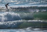 A Surfer Catches a Wave