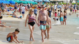Tourists enjoying Waikiki beach