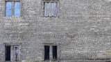 Four windows in a brick wall