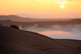 Sunrise in a misty valley