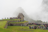 The tourists gathered at a viewpoint in Machu Picchu