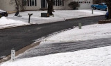 Ice covered driveways down the street