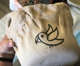 flower pot with bird logo