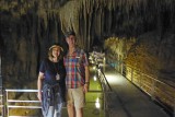 In front of gathered drapes stalagtites in Gyokusendo Cave