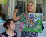 Proud Mama Displays Daughters Painting
