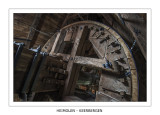 The toothed brakewheel just behind the windshaft head.