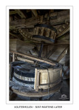Millstones with partially removed wooden casing
