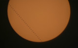 The International Space Station transits the Sun