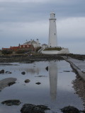 St Marys Lighthouse from causeway with reflection