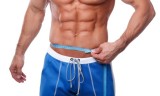 Man measuring his waistline