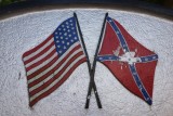US and Confederate flags on historical marker in Knoxville, Tenn.
